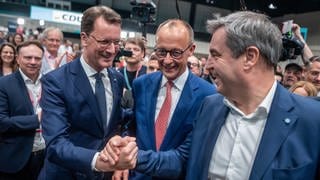 Hendrik Wüst, Friedrich Merz, Markus Söder (Archivbild Mai 2024)