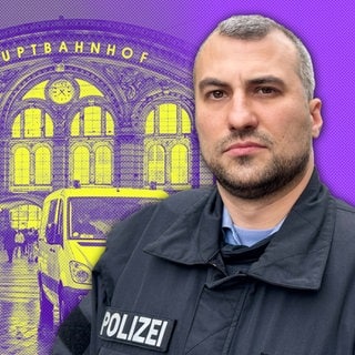 Polizist vor Bahnhogsgebäude