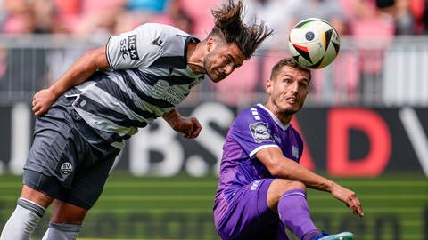 Dominic Baumann vom SV Sandhausen im Duell mit Bashkim Ajdini vom VfL Osnabrück.