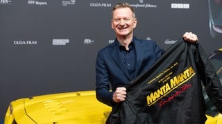 Schauspieler Michael Kessler freut sich bei der Premiere von Manta Manta Zwoter Teil