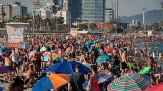 Barcelona, Spain: People crowds and cool off at Bogatell beach in Barcelona amid a heat wave affecting the Iberian Peninsula that is reaching record temperatures for summertime. 