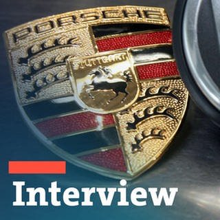 Das Symbolfoto zeigt ein Porsche-Logo mit einem Logo von Volkswagen.
