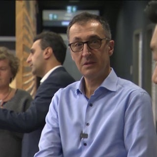 Agrarminister Cem Özdemir mit drei weiteren Personen