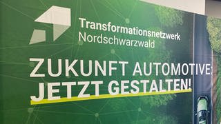 Auf einem Banner wird auf das neue Transformationsnetzwerk Nordschwarzwald hingewiesen