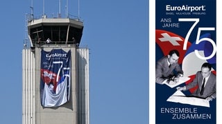 Das Plakat zum Jubiläum des Euroairports wird am Tower aufgehangen 