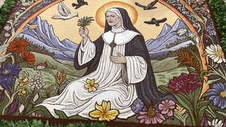 Erntedank im Kreis Tuttlingen: Der Teppich zeigt Hildegard von Bingen zwischen Blumen, Bergen und Wäldern