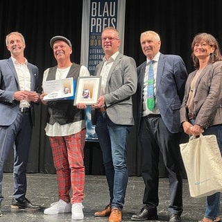 Bei einer Gala in der Rottenburger Festhalle ist am Sonntagabend beim Finale des Sebastian-Blau-Preises 2024 der Sieger gekürt worden. Gewonnen hat Michael Klink aus Neuffen (Kreis Esslingen) mit seiner schwäbischen Kultfigur "LinkMichel". 