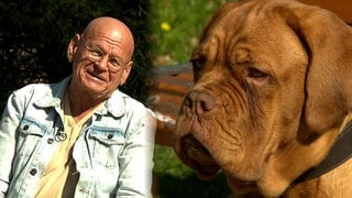 Rentner Uwe Schmid und seine Bordeauxdogge Eddy. Ihre Köpfe sind nebeneinander zu sehen. Beiden wurde schon von vielen eine gewisse Ähnlichkeit nachgesagt.