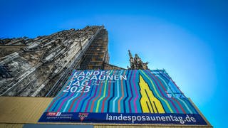 Ein Plakat zum Landesposaunentag am Ulmer Münster: Zum ersten Mal seit 2018 gibt es in Ulm wieder einen Landesposaunentag der evangelischen Landeskirche Württemberg. 