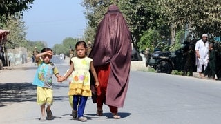 An Afghan family leaves Kunduz city following clashes between Taliban and Afghan security forces, Kunduz, Afghanistan, 22 August 2016