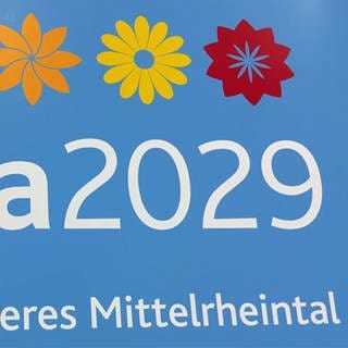Der Schriftzug Buga 2029 mit drei stilisierten Blumen