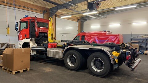 Ein sogenannter Wechsellader der Feuerwehr. Der Aufbau des Fahrzeugs kann je nach Einsatzzweck variiert werden.