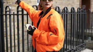 A chic showgoer posing on the street outside the Preen show during London Fashion Week 