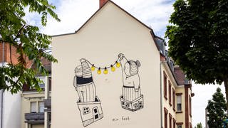 Mural-Kunstwerke vom Duo Sourati 