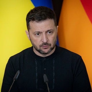 Volodymyr Zelenskyy, listens to a question during a joint press conference with German Chancellor Olaf Schotz,