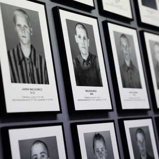 Portraits of prisoners are seen at the former Nazi German concentration camp Auschwitz-Brikenau