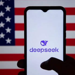 January 31, 2025, India: In this photo illustration, the DeepSeek logo is seen displayed on a mobile phone screen with American flag in the background. 