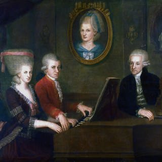 „Die Familie Mozart“ (1780-81) von J.N. de la Croce: Leopold (1719-87), mit Tochter Maria-Anna (Nannerl) und Sohn Wolfgang Amadeus (1719-87) am Klavier. 