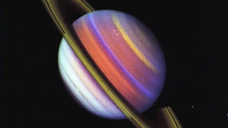 This psychedelic false-color view of Saturn from Voyager 2 reveals structure in the planet s banded clouds.
