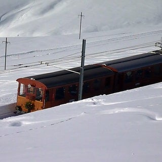 Reisen wie vor 100 Jahren im Eiger Ambassador Express vor Eiger und Mönch.