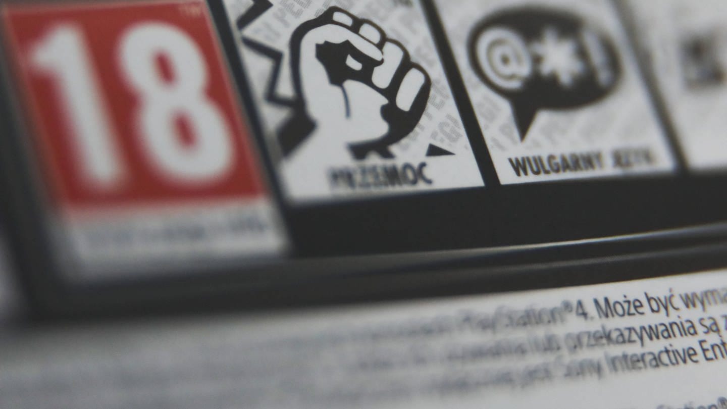 Das Bild zeigt die Warnhinweise auf der Verpackung eines Videospiels, tags: Gewalt, Empathie, Studie